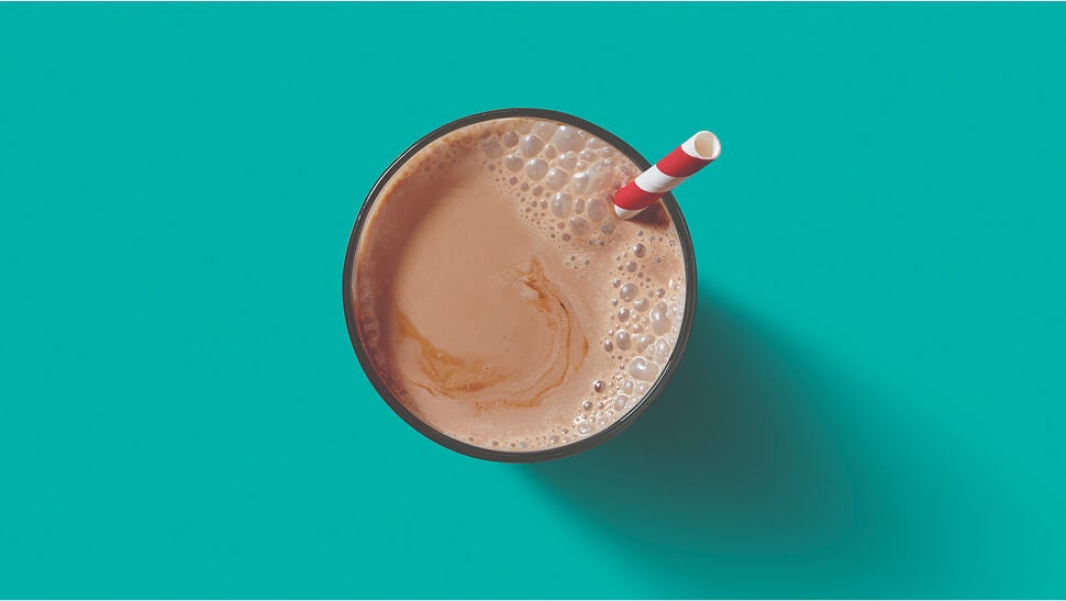 top down view of a glass of chocolate milk