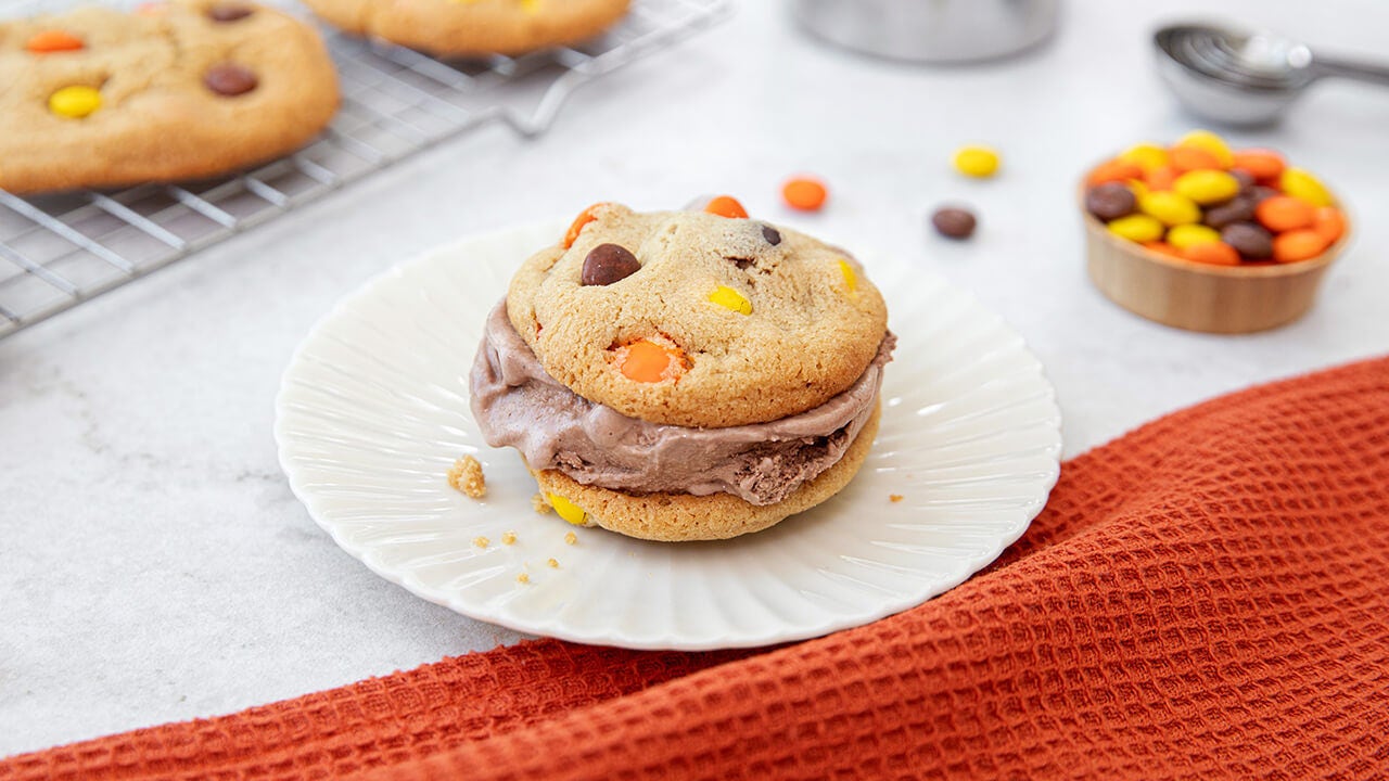 homemade ice cream sandwiches with chocolate ice cream and reeses pieces cookies