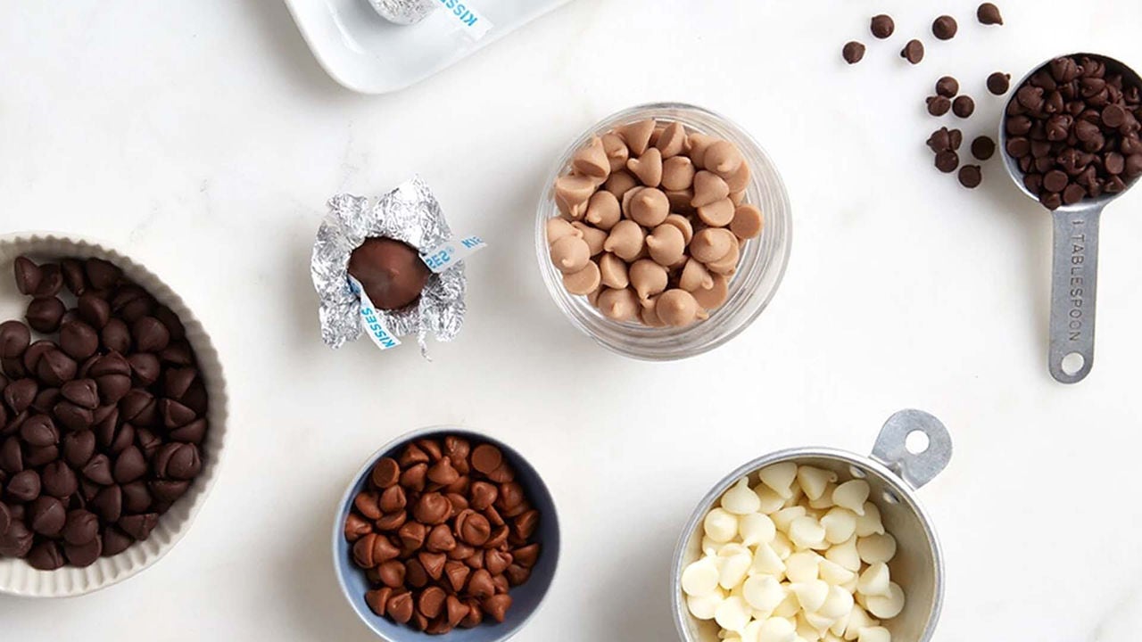 bowls and measuring cups filled with assorted hersheys baking chips