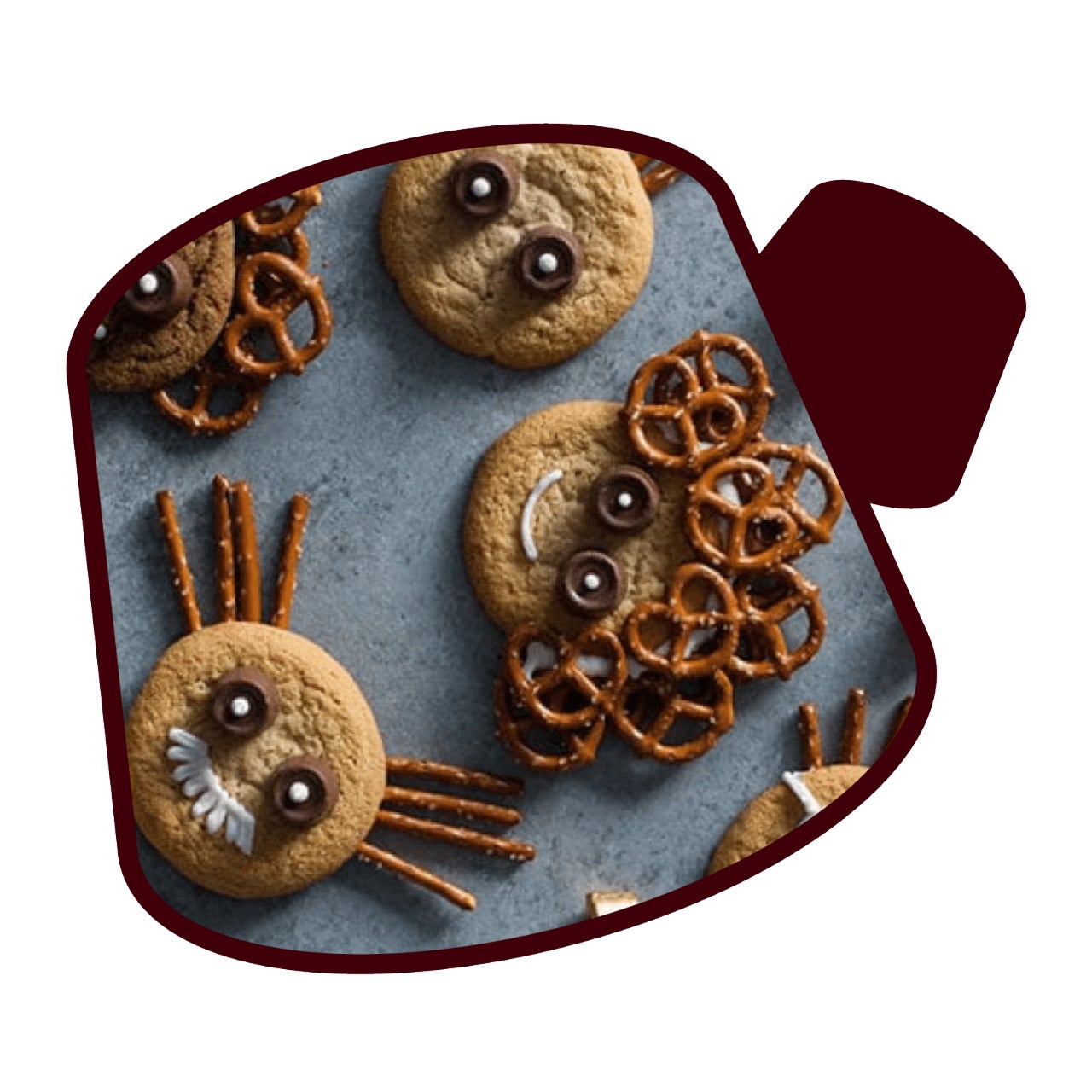 cookies decorated to look like people using pretzels and rolo candies