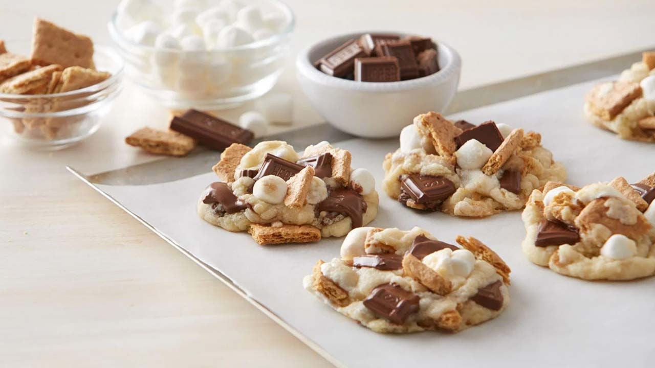 batch of hersheys smores cookies cooling on parchment paper