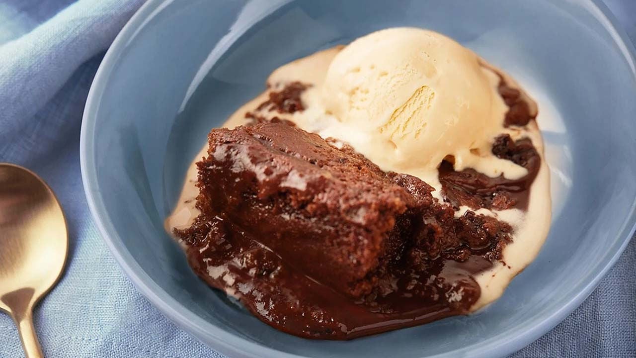 bowl of hersheys hot fudge pudding cake topped with vanilla ice cream