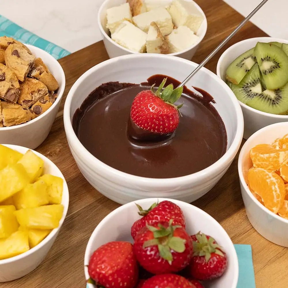 bowls of fruit to be dipped in chocolate fondue