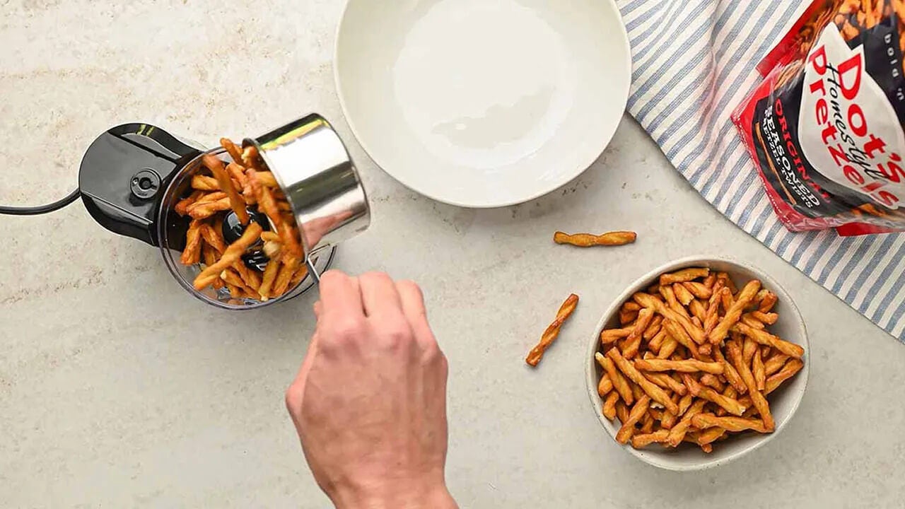 pretzels being put in food processor