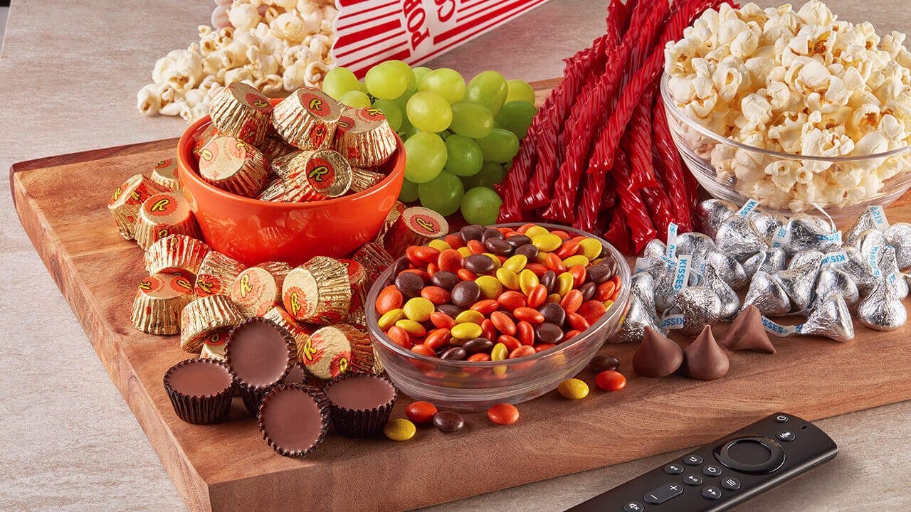 movie night charcuterie board filled with candy and snacks