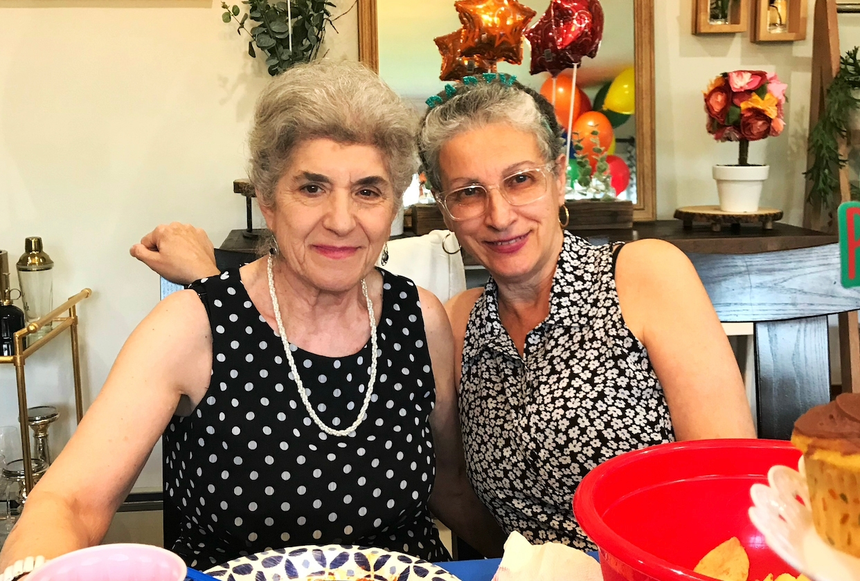 grandparents sitting at the table and smiling