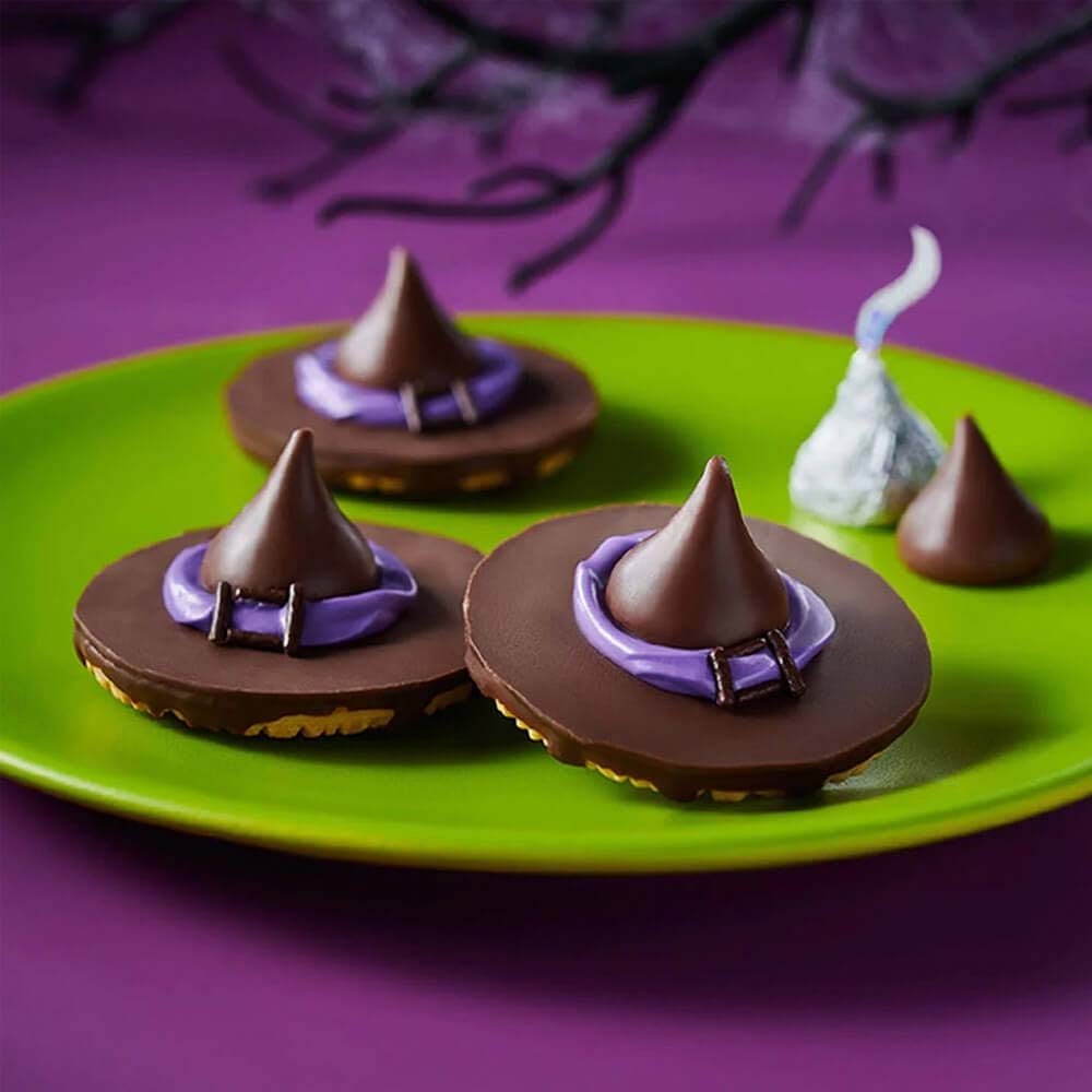 plate of hersheys kisses witch hat cookies