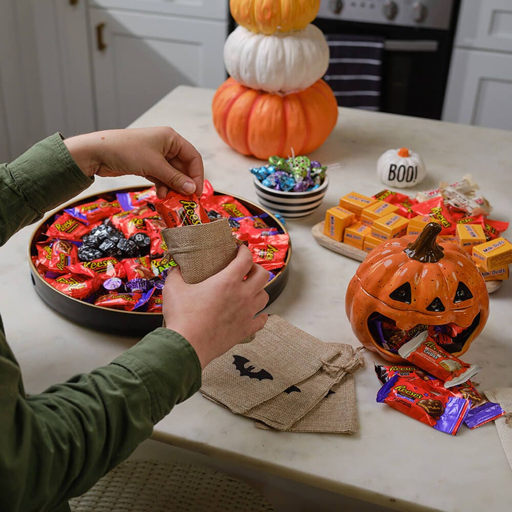 kitchen island with pumpkin decorations and halloween candy