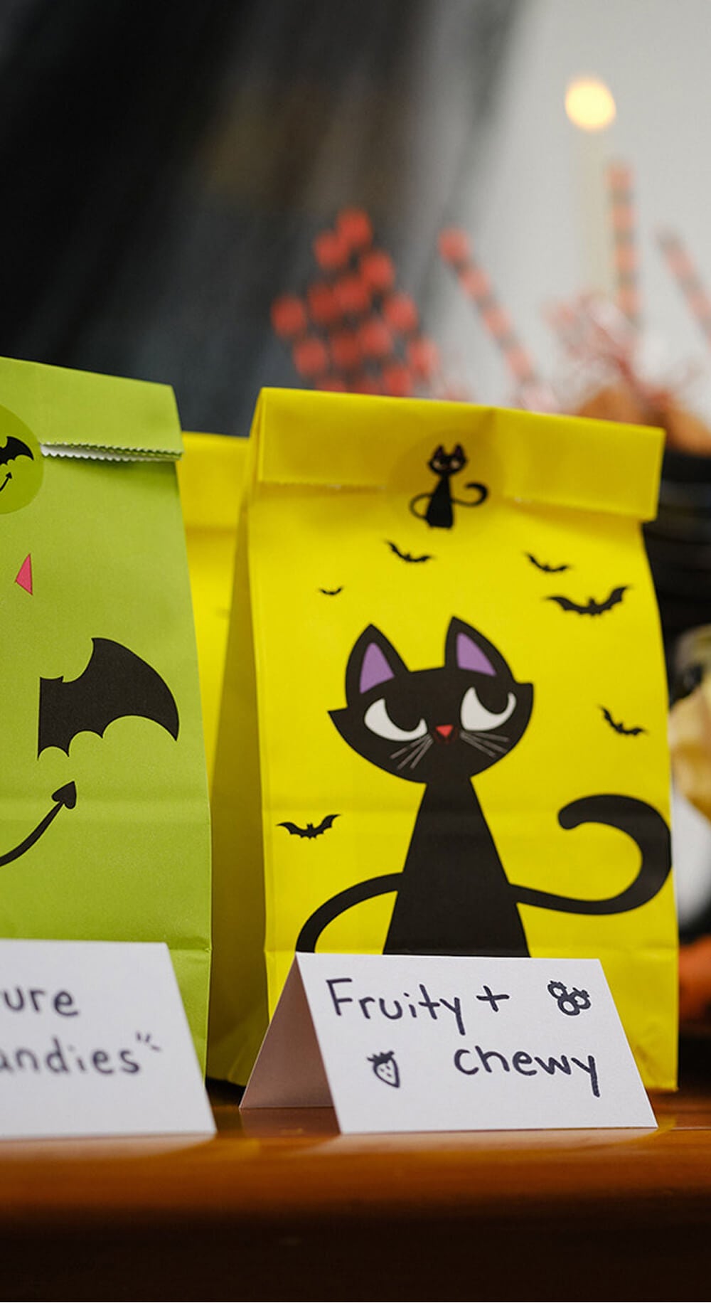 yellow treat bag with black cat design on front