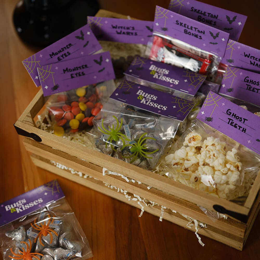 wooden crate full of scary halloween themed snack bags