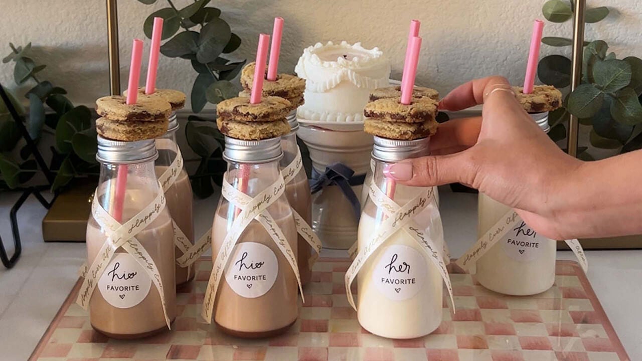 his and her bottles of milk topped with hersheys milk chocolate chip cookies