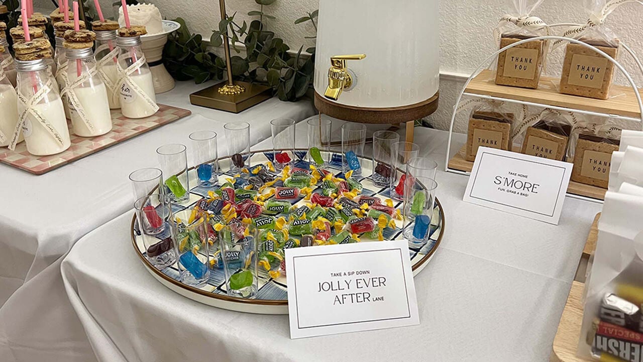 tray of glasses and an assortment of jolly rancher original hard candies